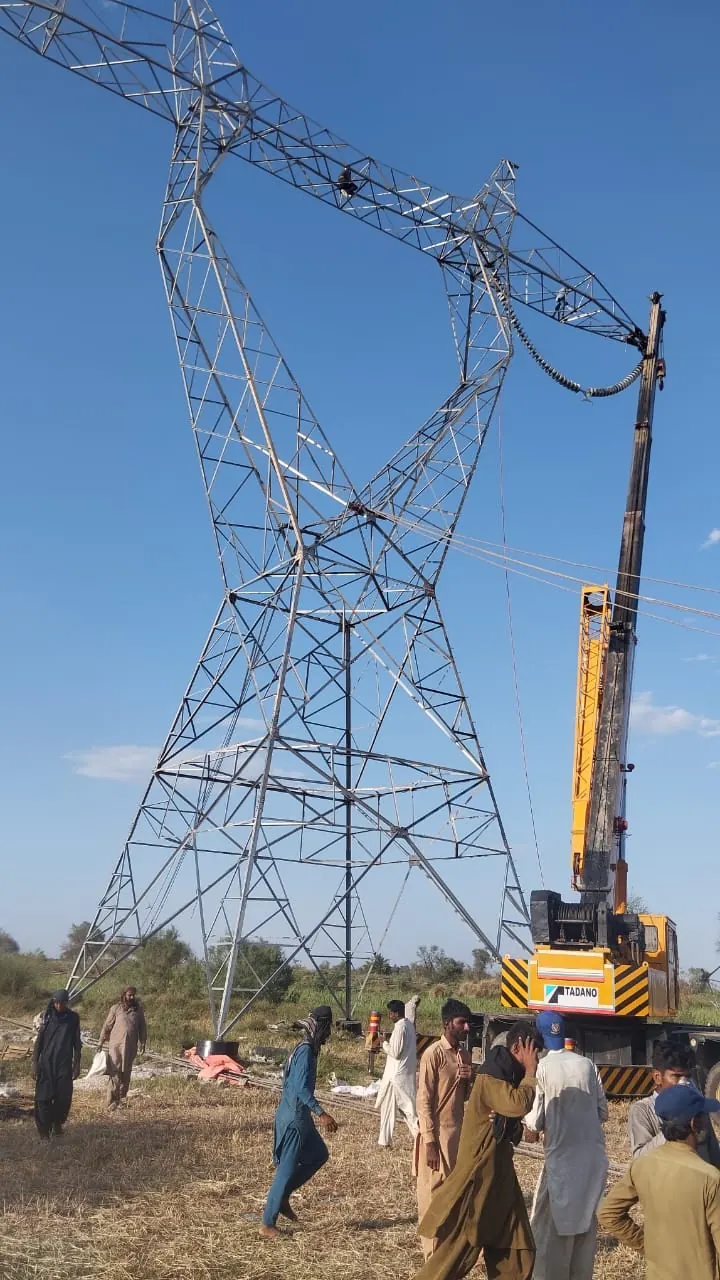 MRCC crew on site as the crane raises the crossarm