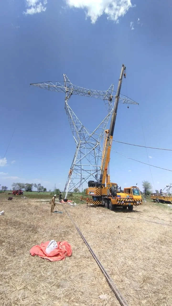 Rebuilt tower standing with the crane alongside