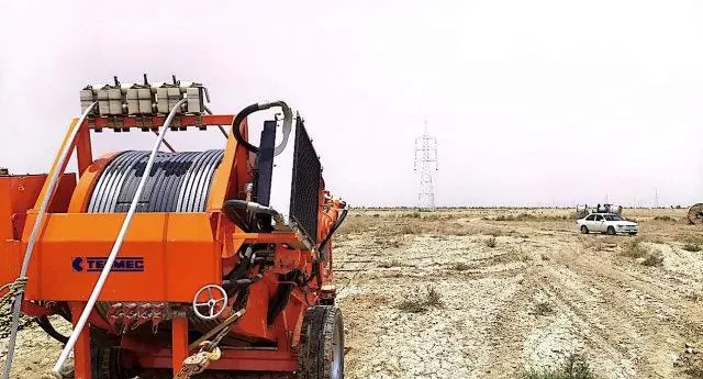 Orange TESMAC conductor puller on site
